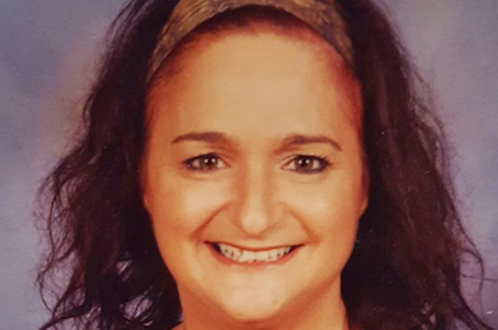 Profile photo of Diane Micallef with a purple background. 