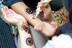 close up on arms with henna