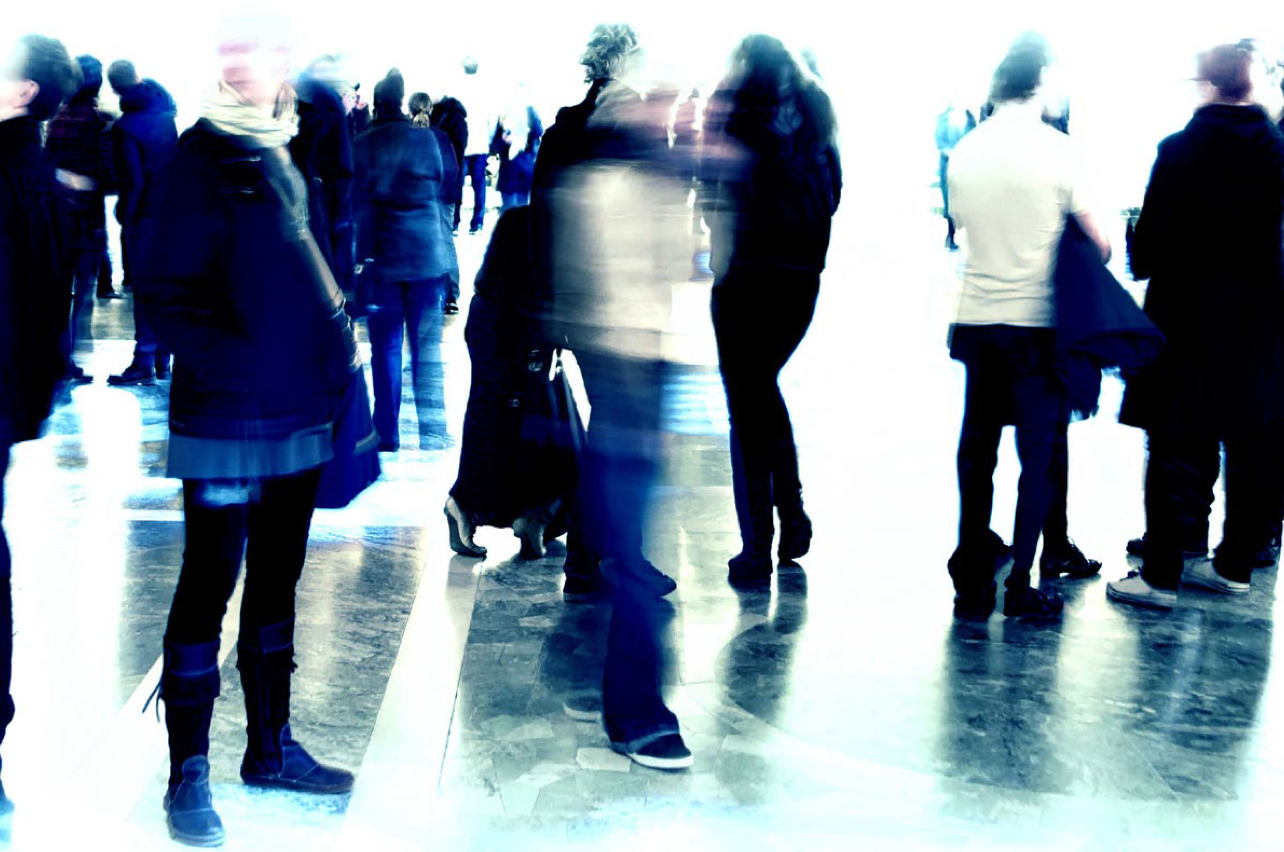 Experiences of hepatitis C diagnosis Over-exposed, blurred image of people standing and walking in a large public area