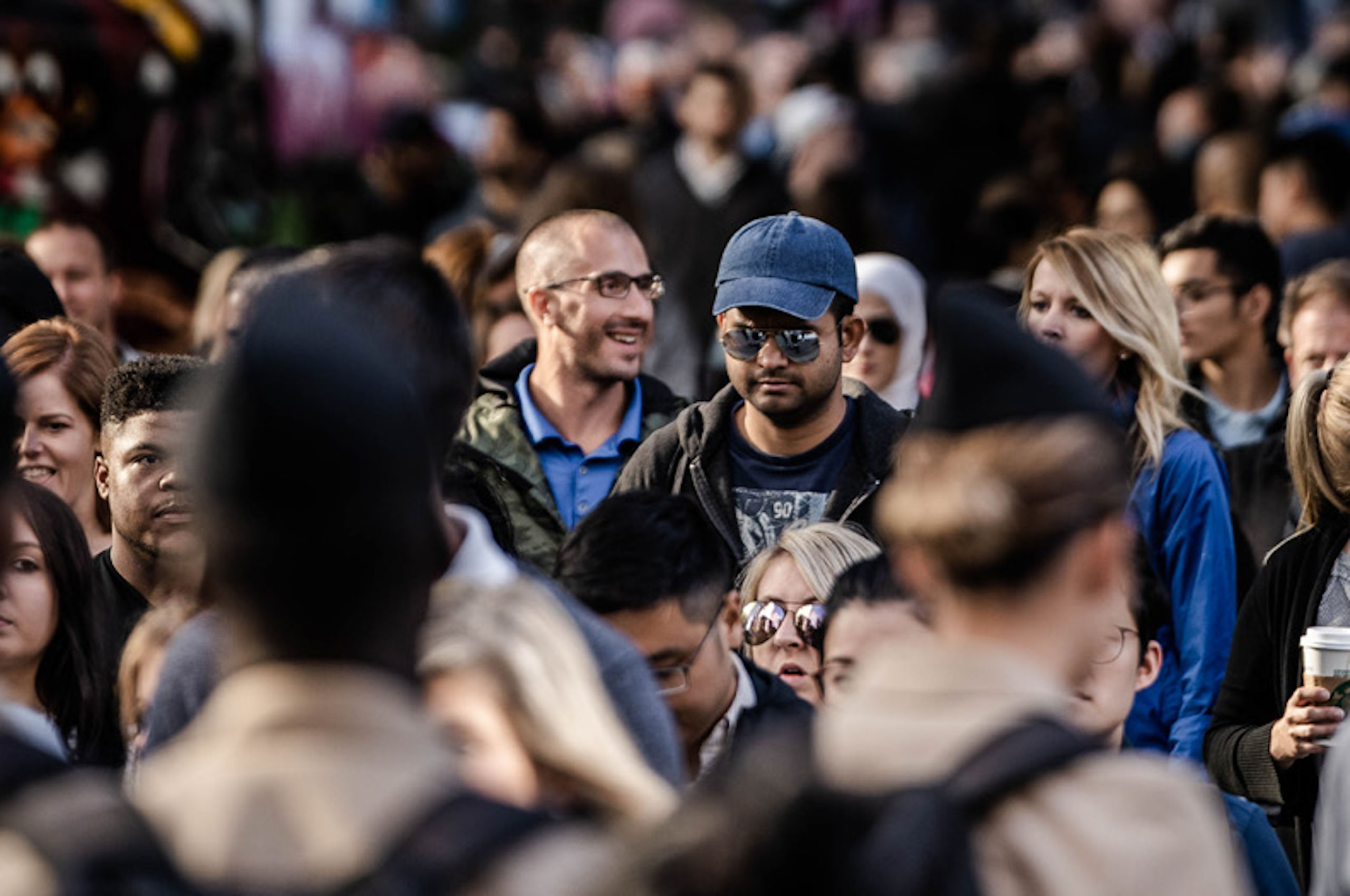 Peer Insights: Hepatitis C treatment - Broadsheet No. 2 Multicultural crowd of people walking on the street