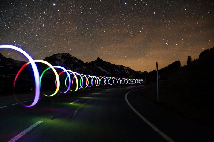 Coloured lights along a road at night