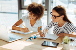 Students taking notes from laptop